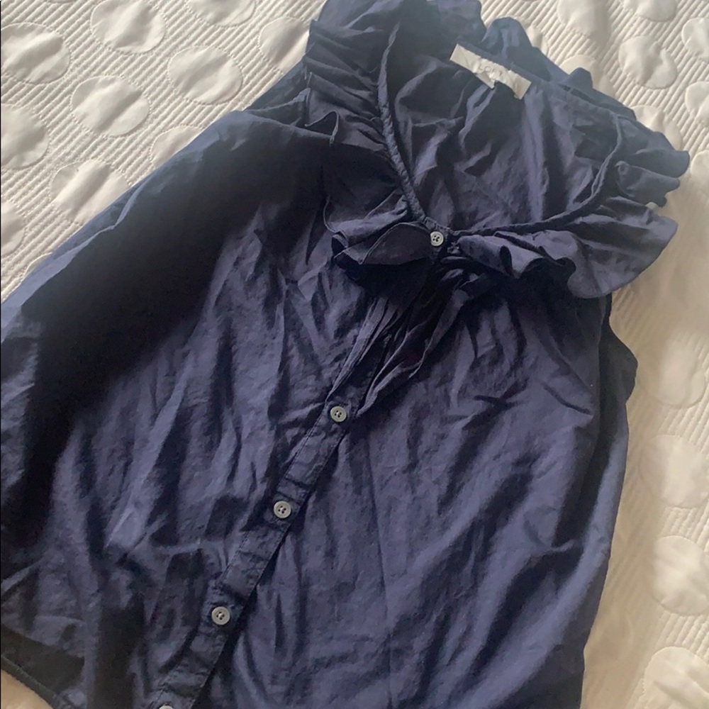 Sleeveless ruffled top.